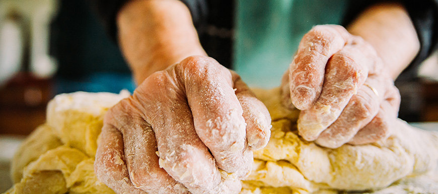 hands kneading bread